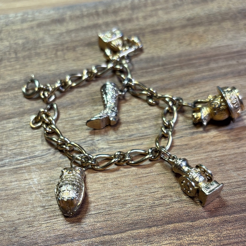 Avon gold tone charm bracelet